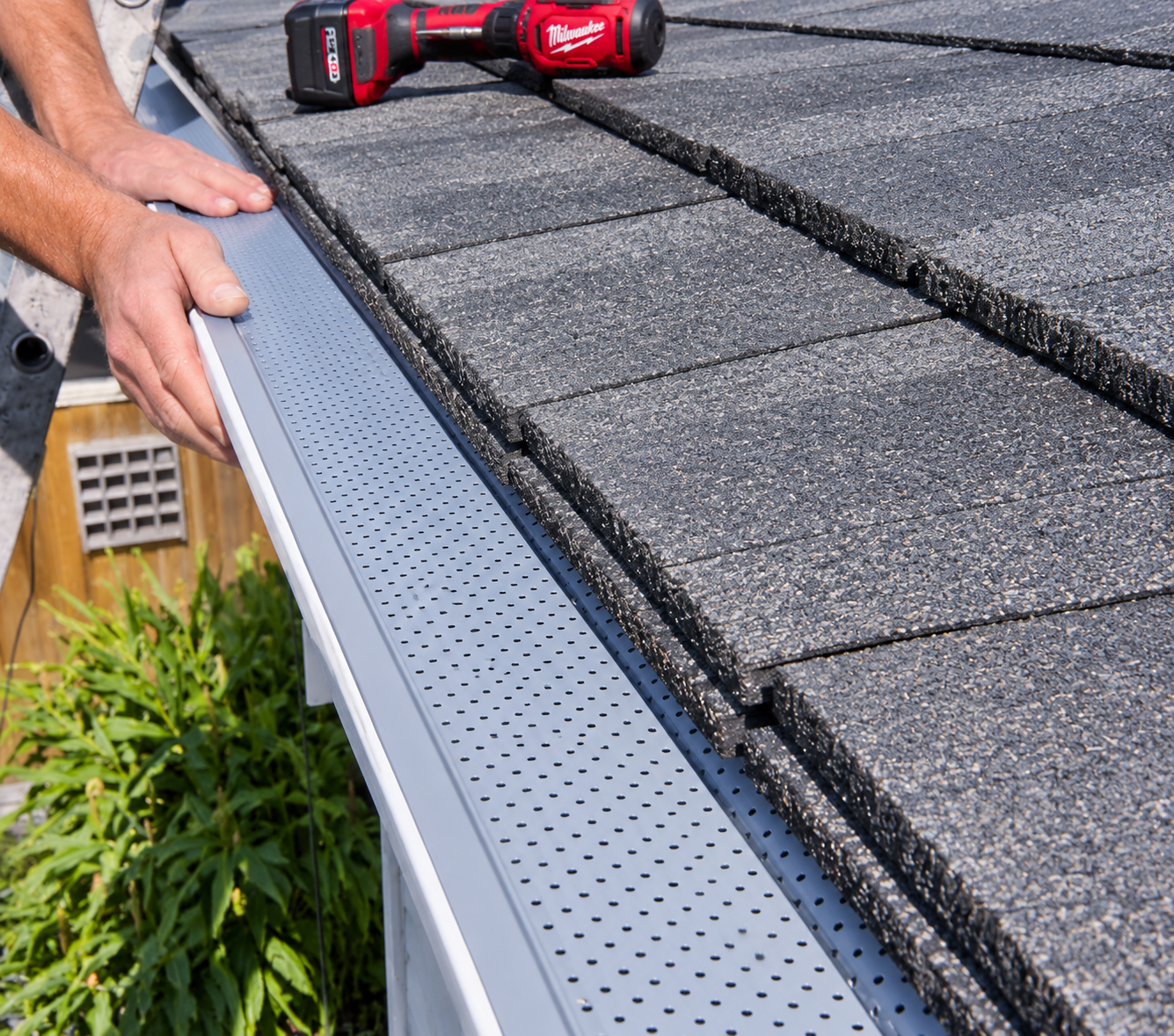Newly installed mesh gutter guard on a residential eavestrough